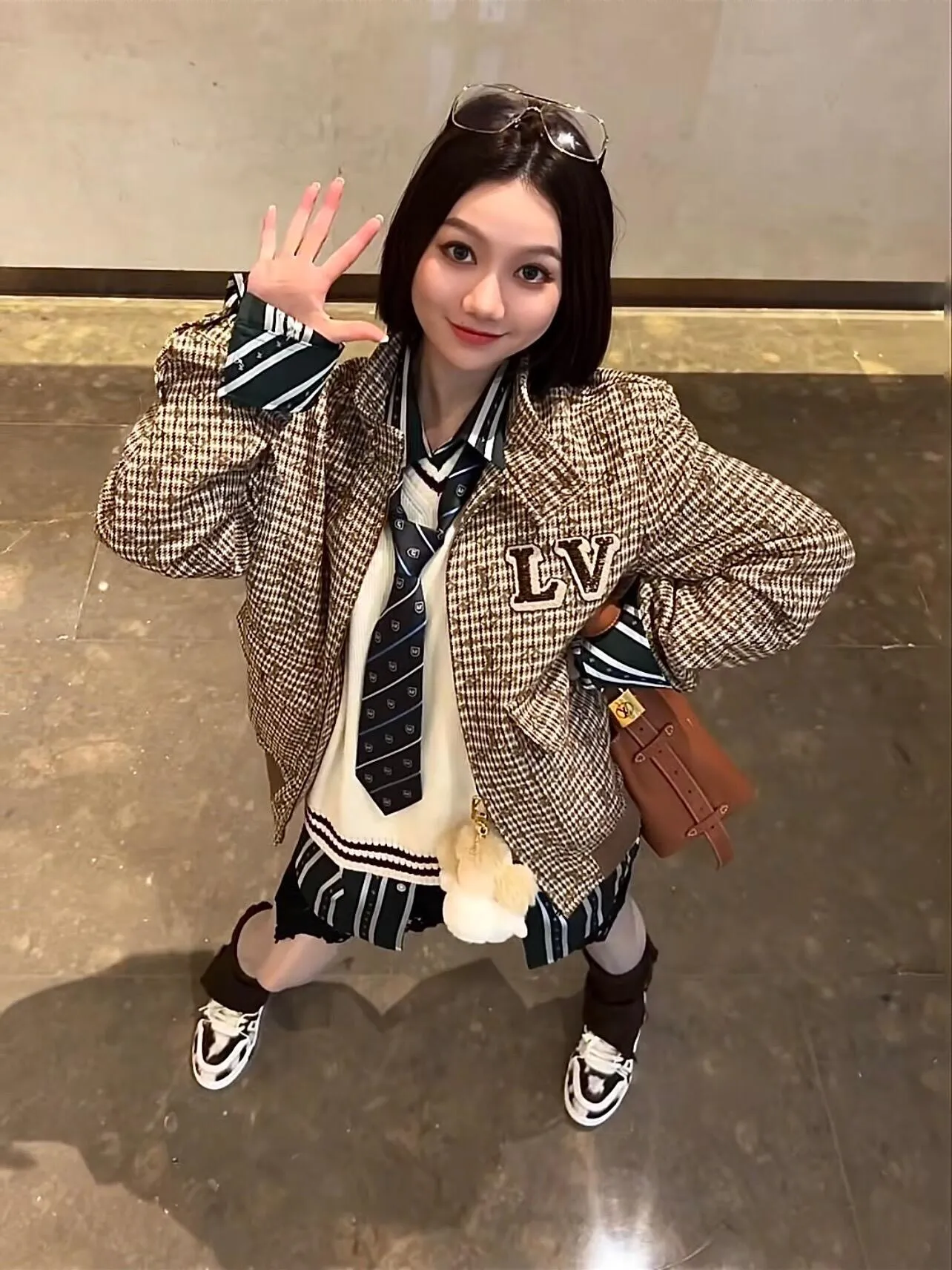 Louis Vuitton jacket with embroidered badges and all-over monogram print.